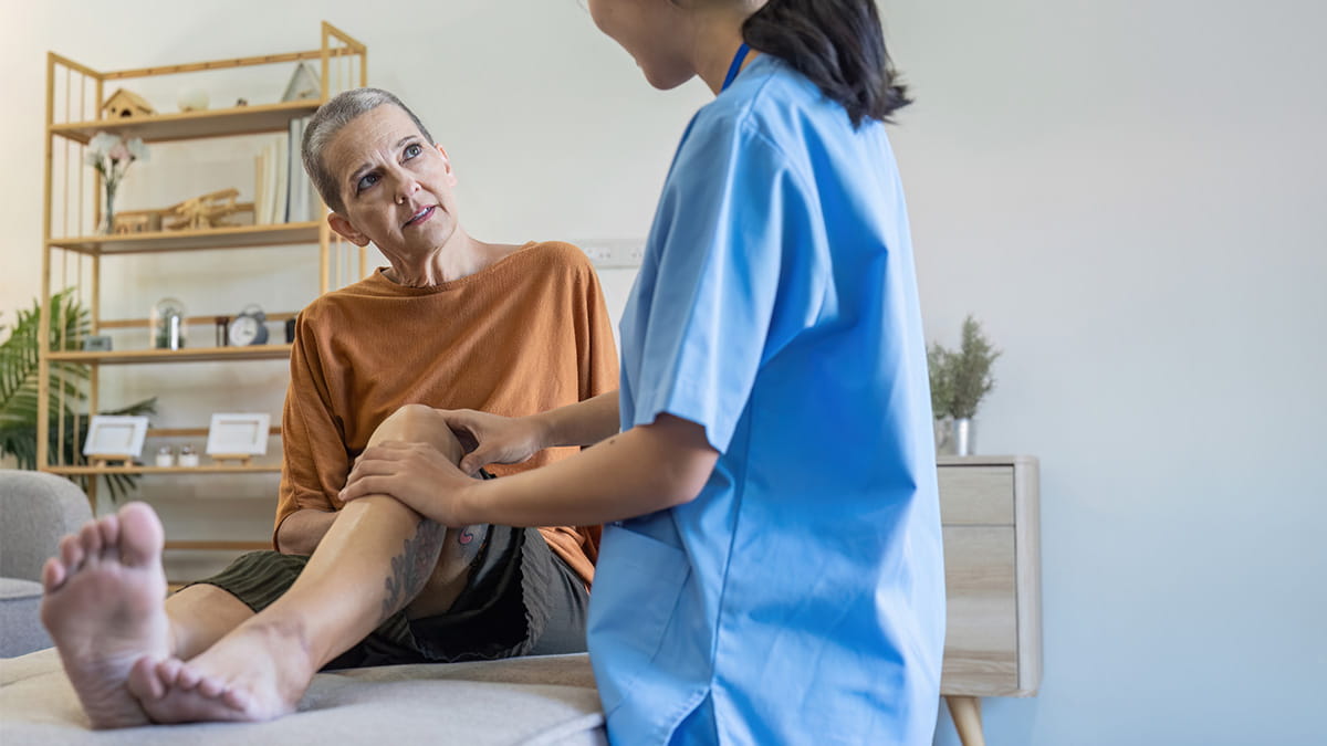 Nurse helping older woman