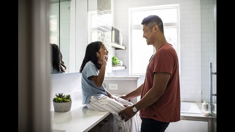 Father looking at daughter