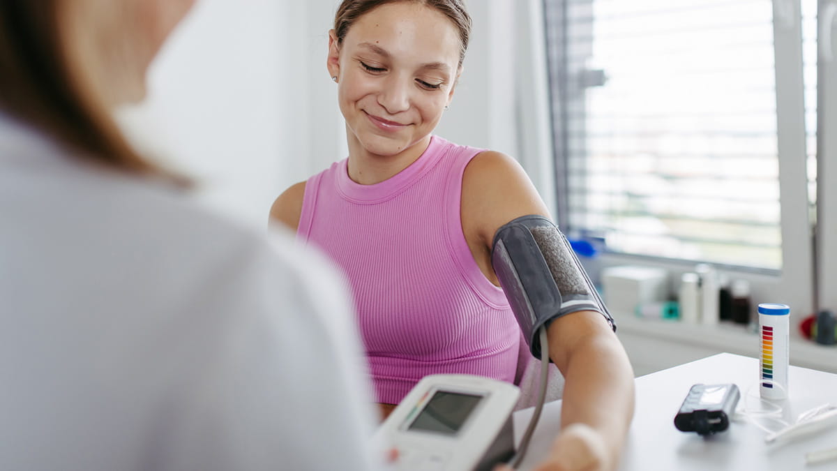 Girl getting her blood pressure checked