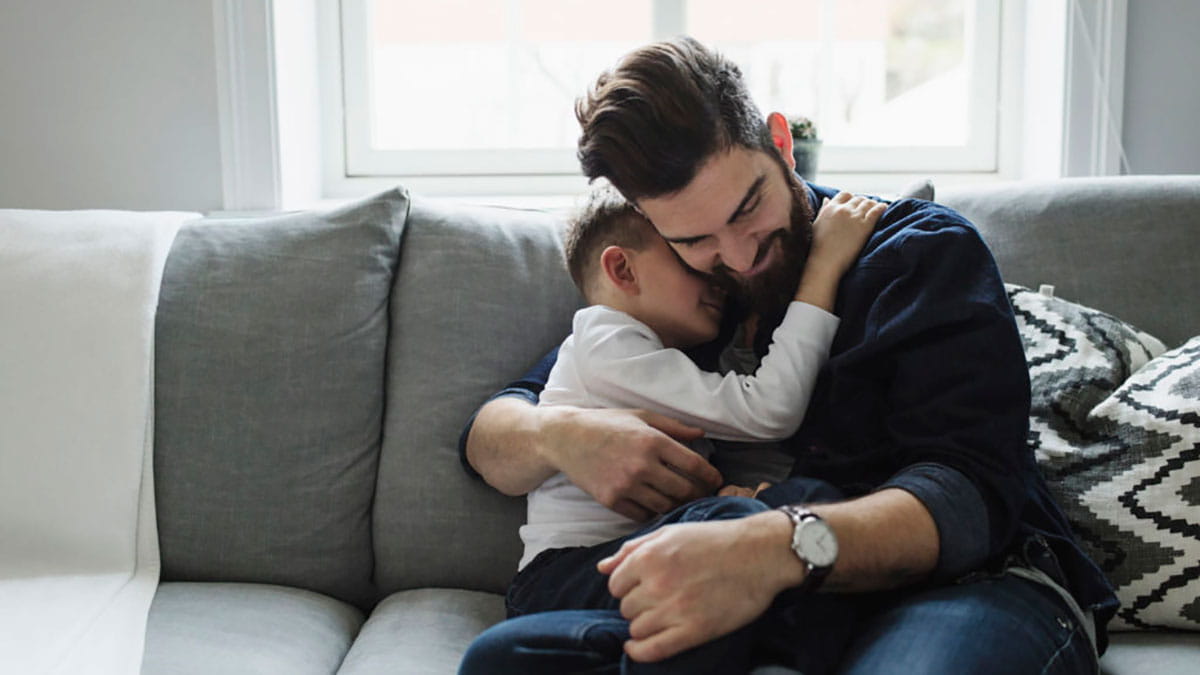 Father cuddling child