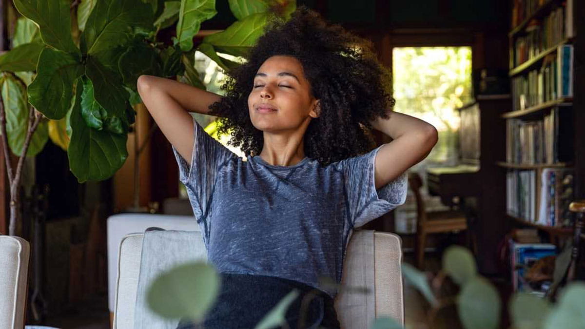 A young woman meditating outdoors