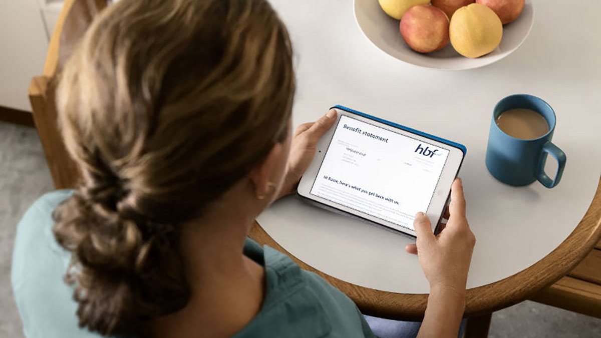 Woman accessing myHBF on tablet
