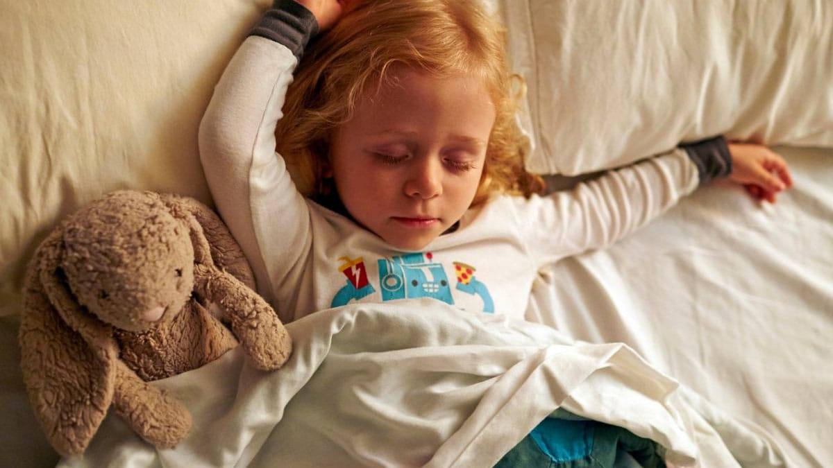 A child asleep in bed