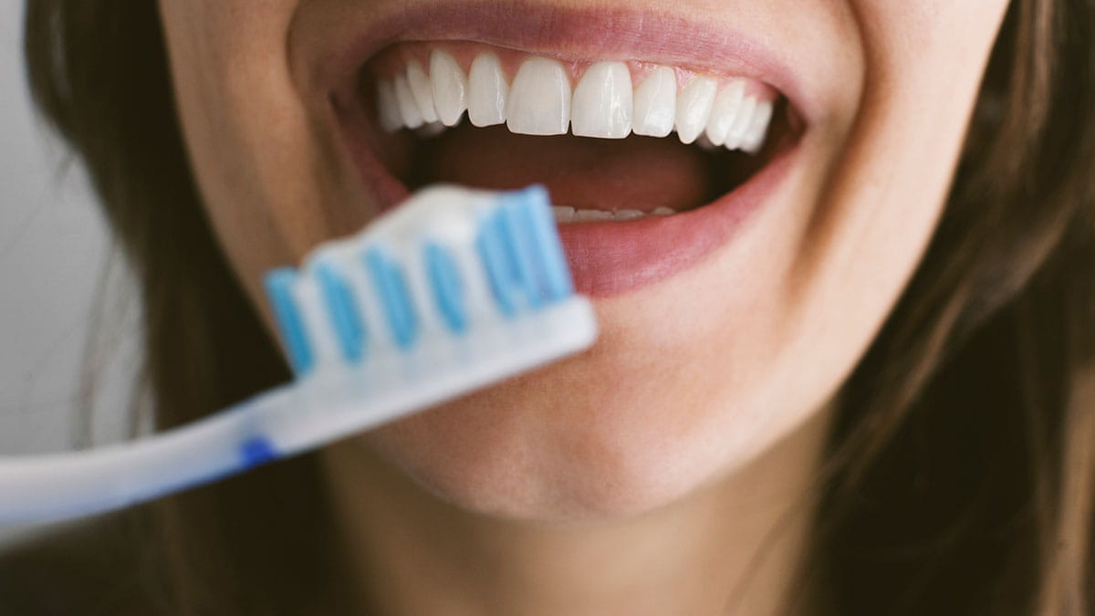 Woman brushing her teeth