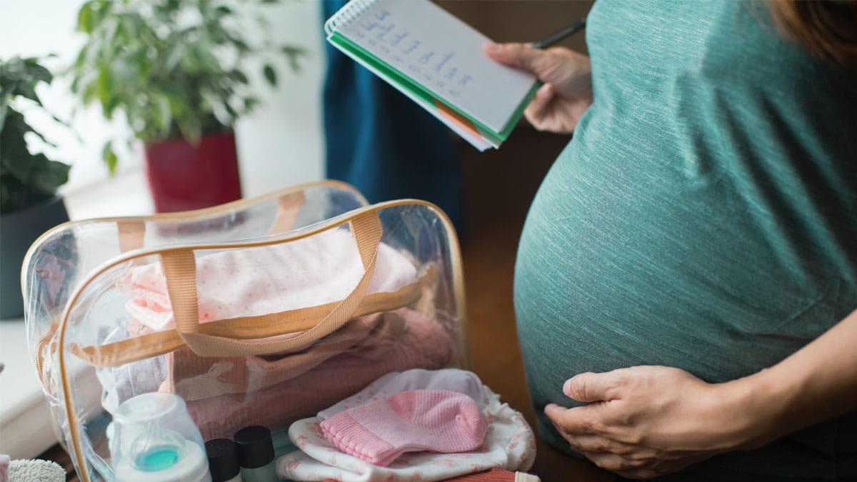 Pregnant lady packing her hospital bag