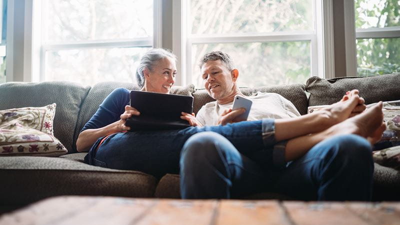 Older couple sitting on the couch