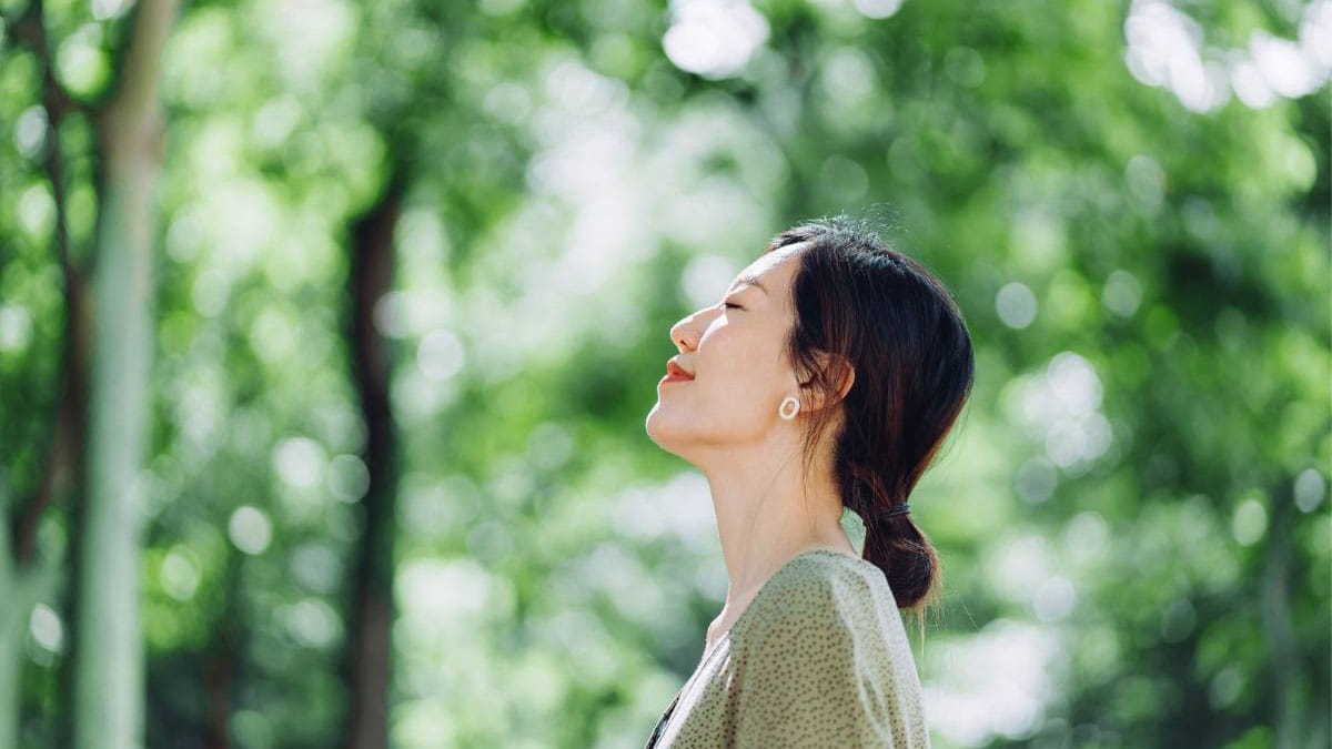 Woman smiling with eyes closed
