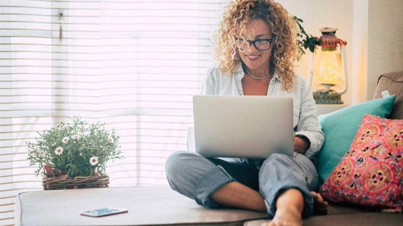 Woman comparing Extras options on laptop