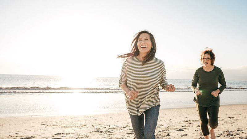 Women running on a beach