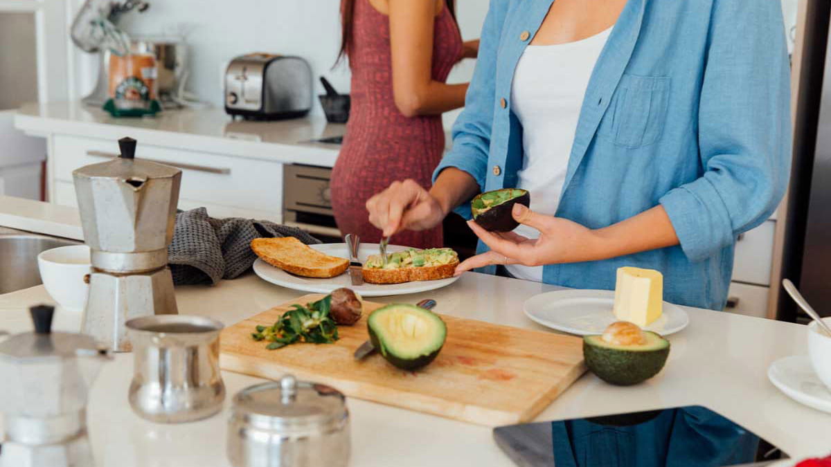 Woman in kitchen preparing a healthy recipe