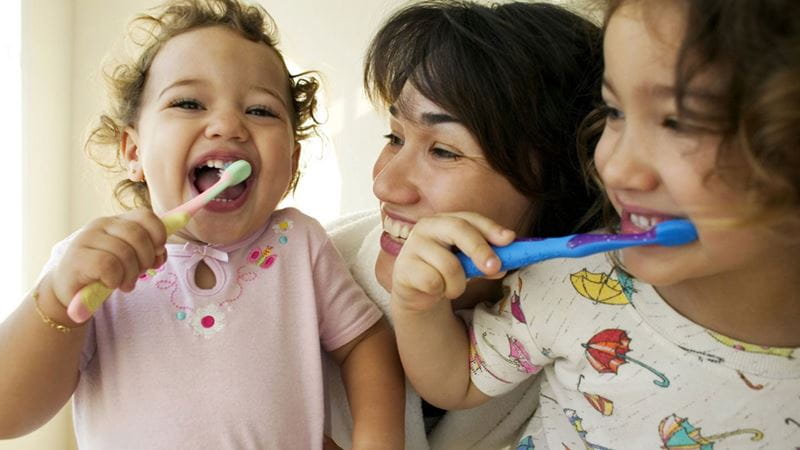 Kids brushing their teeth