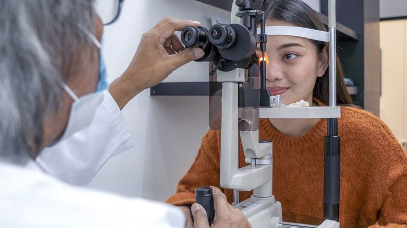 Young woman getting eyes tested