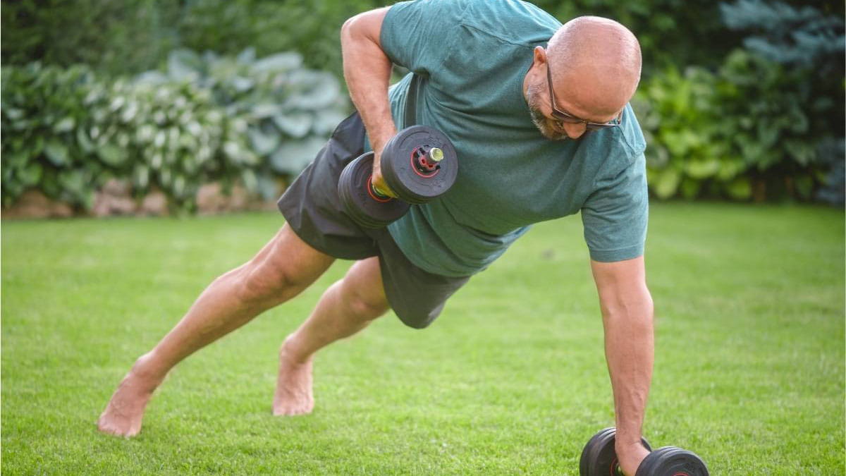 Man doing push-ups with weights