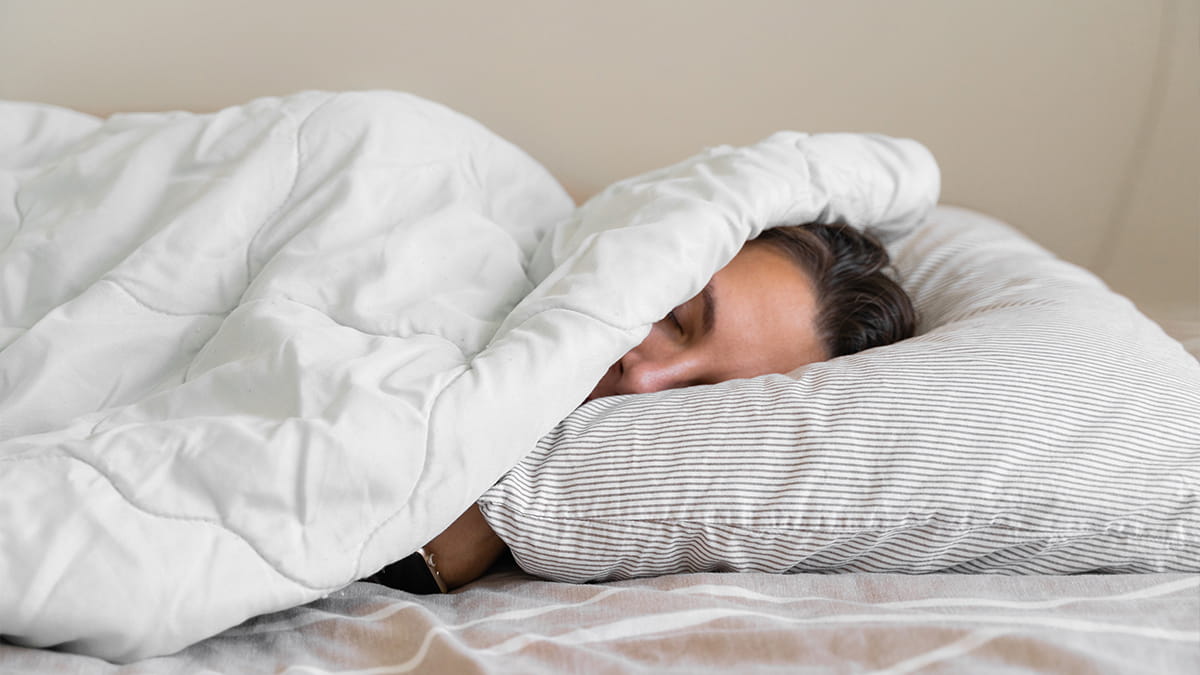 Woman asleep in bed