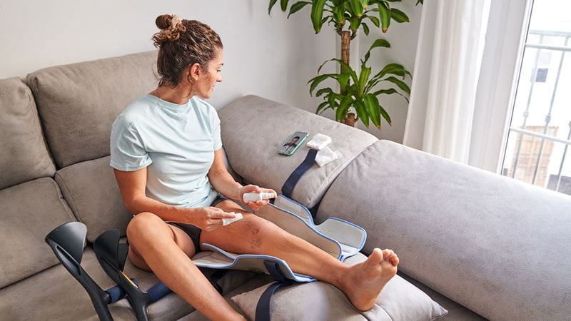 Woman implementing post-surgery care at home