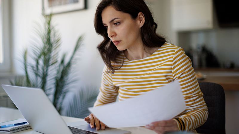 Woman looking into elective surgery on her laptop