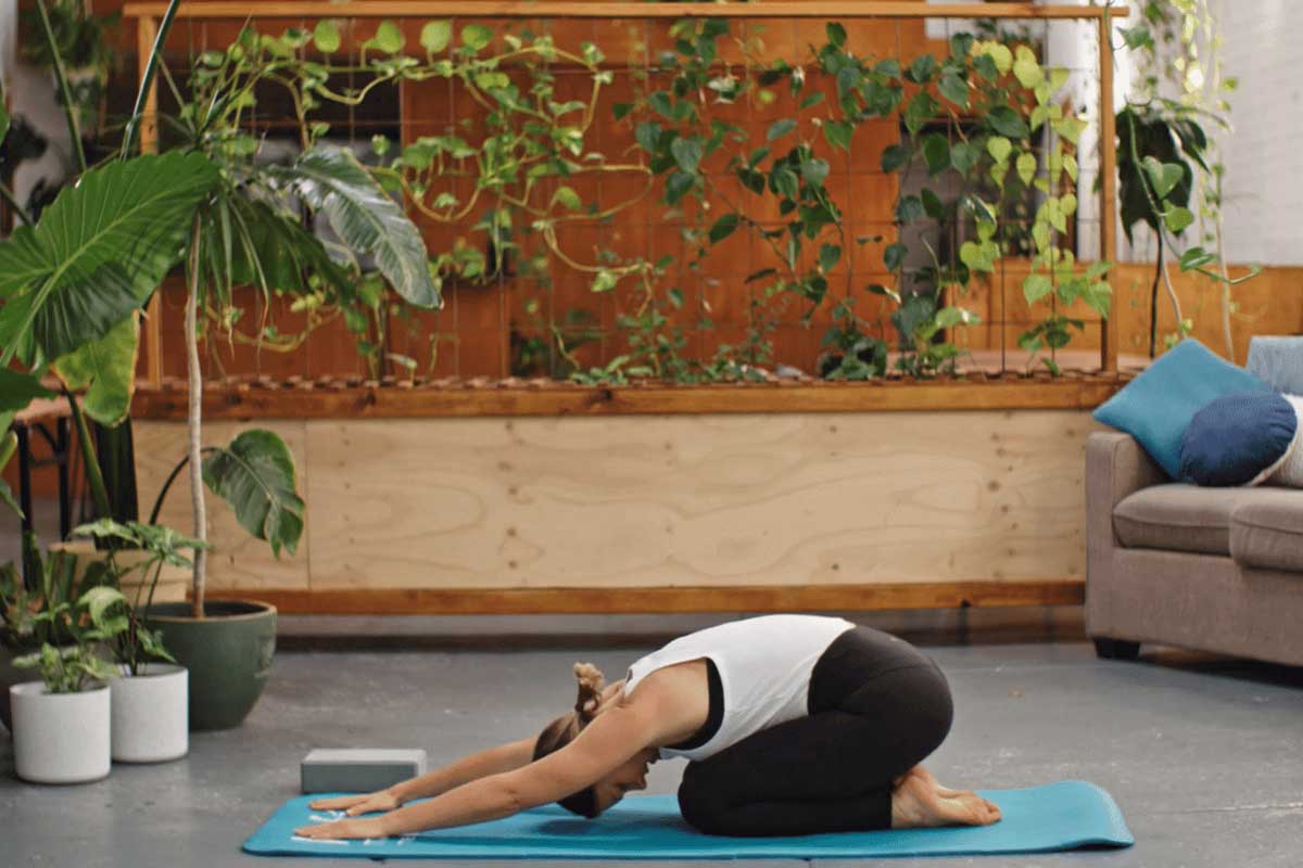 Woman doing yoga childs pose