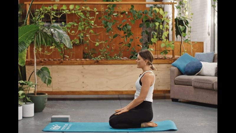 Woman doing yoga seated rest