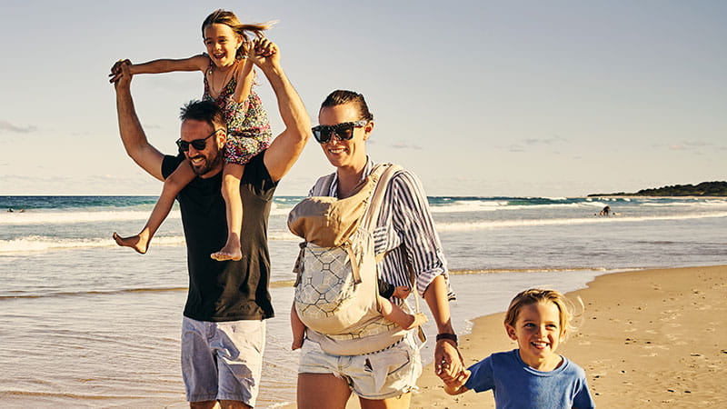 Family walking along the beach