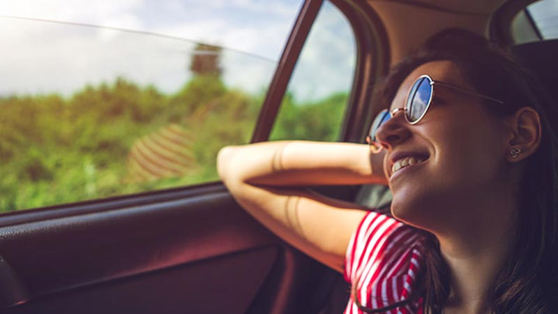 Girl looking out car window