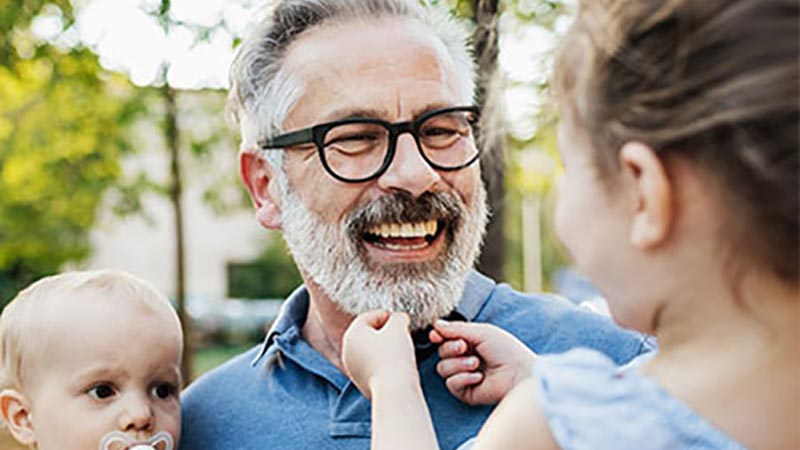 Happy grandfather wearing glasses