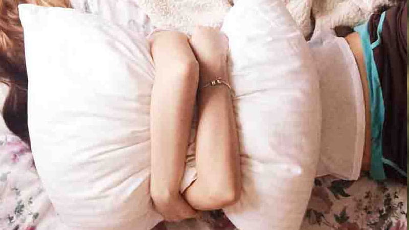 Person holding pillow