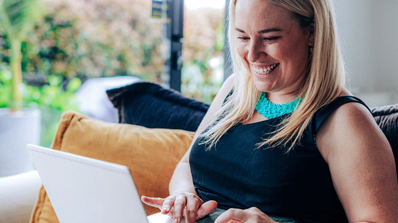 Woman typing on laptop