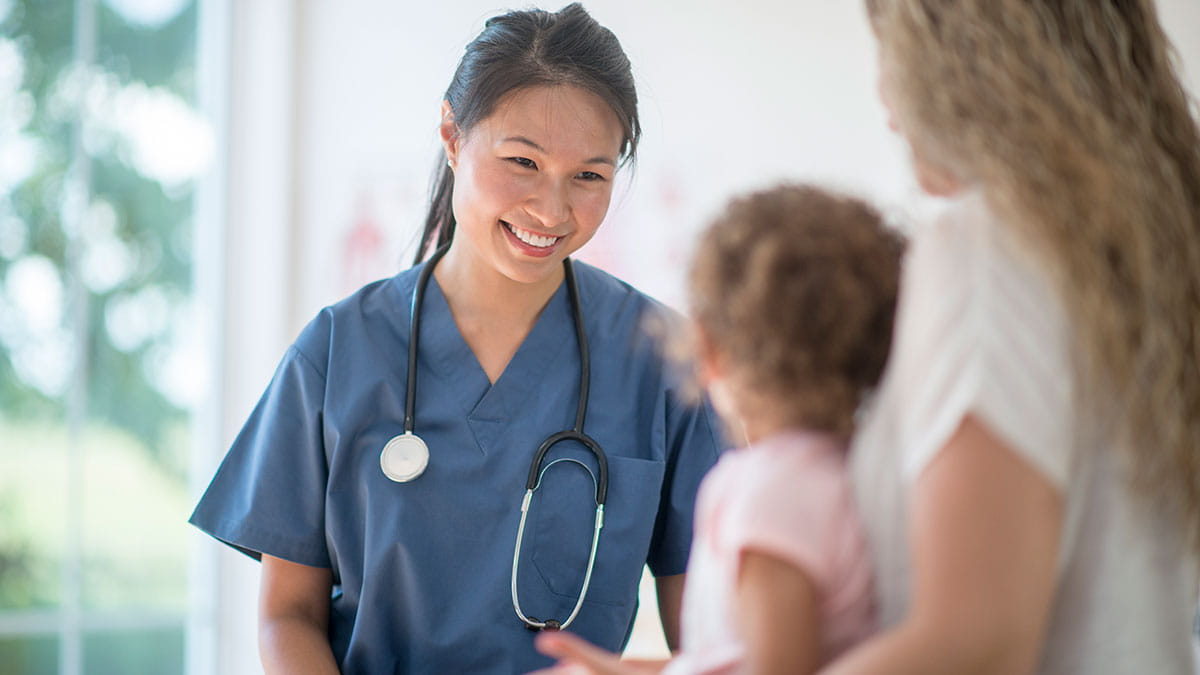 Doctor talking to young patient