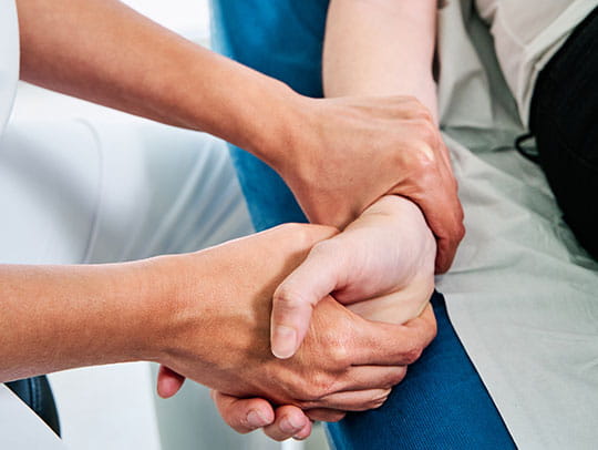 Nurse holding patients hand
