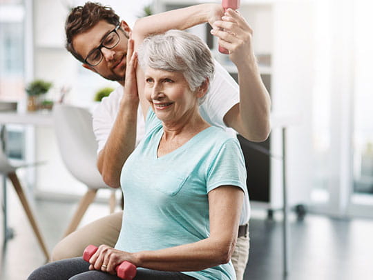 Mature woman doing gym exercises