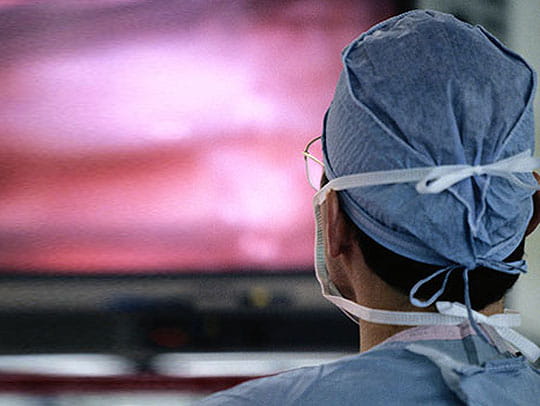 Cardiologist looking at screen