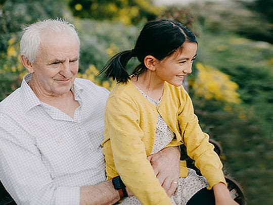 Grand parent sitting with child
