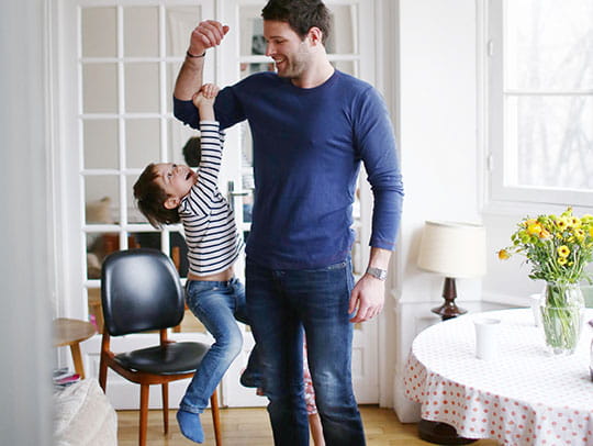 Father holding daughter