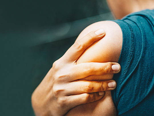 Person holding arm