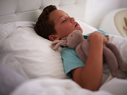 Young boy in hospital bed