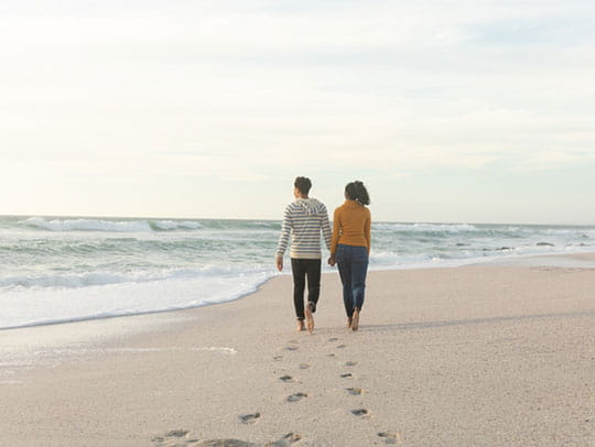 Couple walking on beach