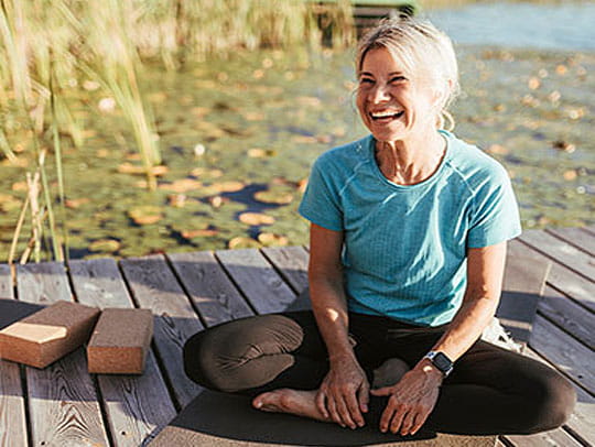 Woman sitting on jetty