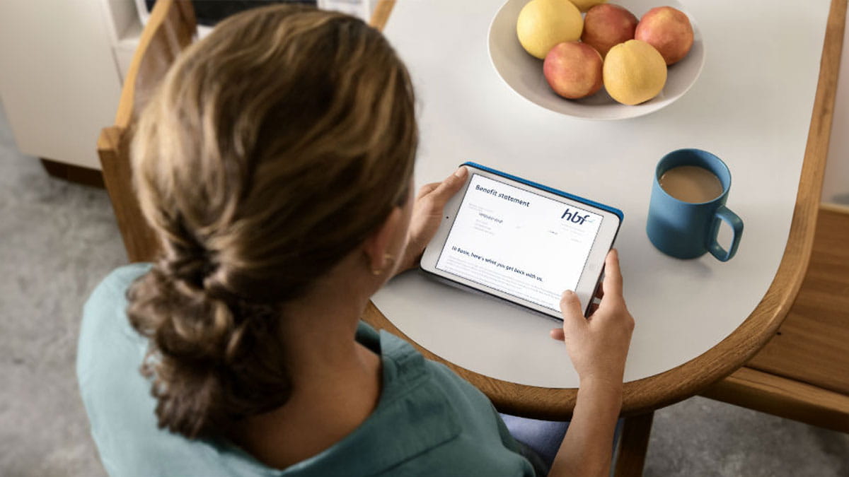 Woman looking at her hbf account online using a tablet