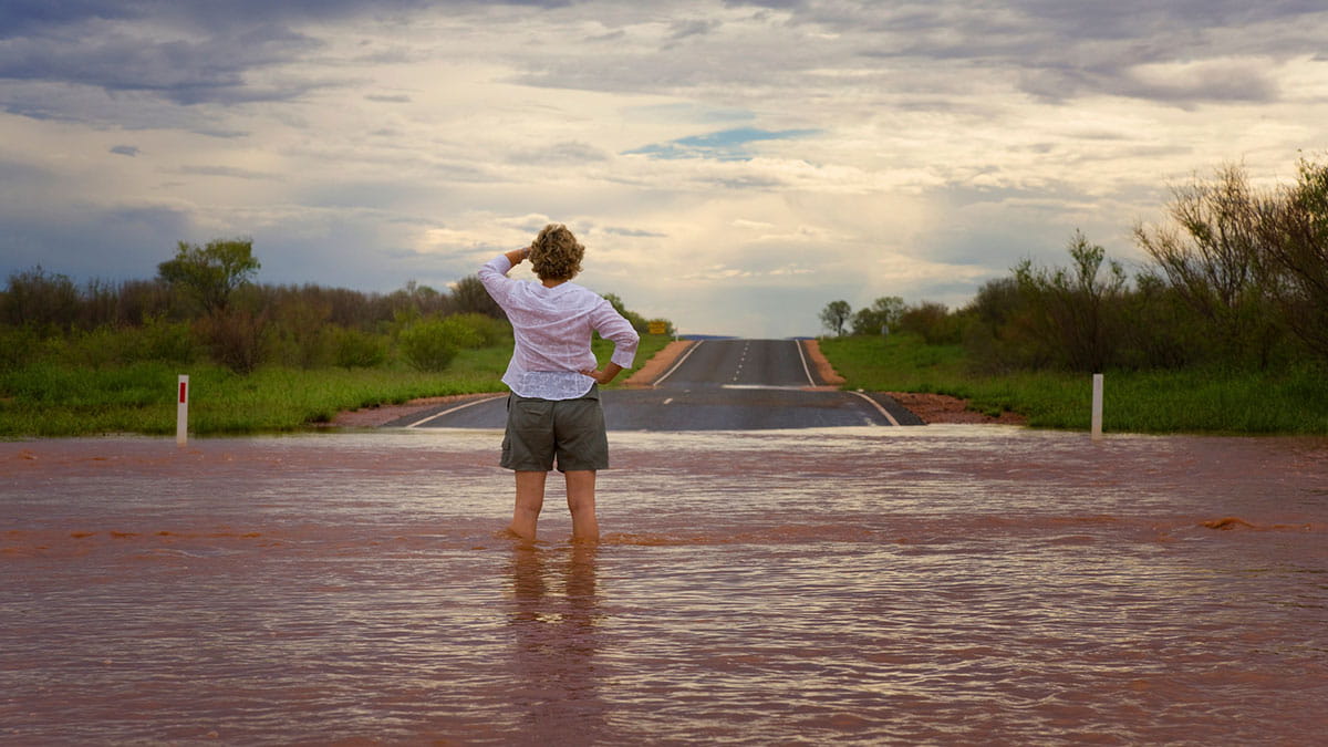 Woman standing in flood waters