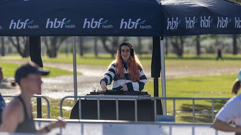 Woman dj-ing for run participants