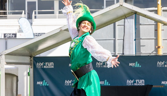 Woman in green costume at Run for a Reason finish line