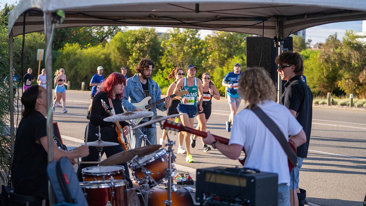 Band plays while HBF Run for a Reason participants run past in background