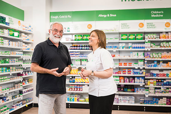 Terry White pharmacist with customer