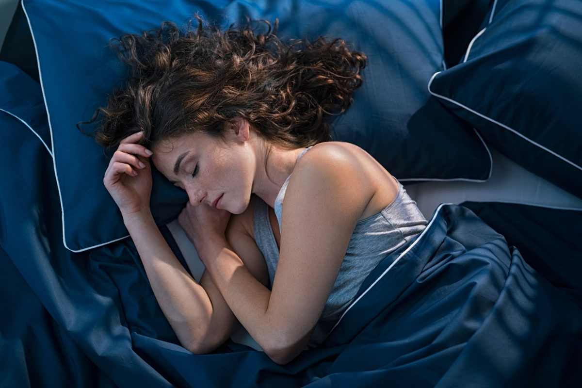 A young woman sleeping in bed