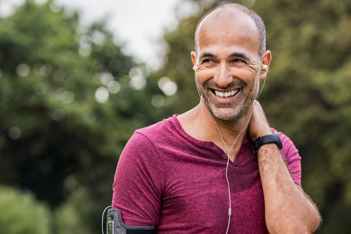A man smiling after exercise outdoors