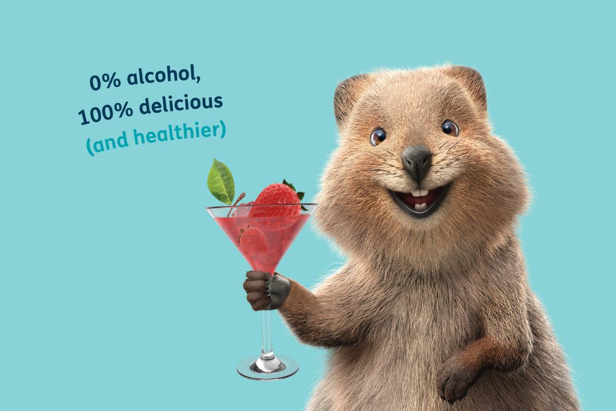 HBF Quokka holding mocktail with strawberries