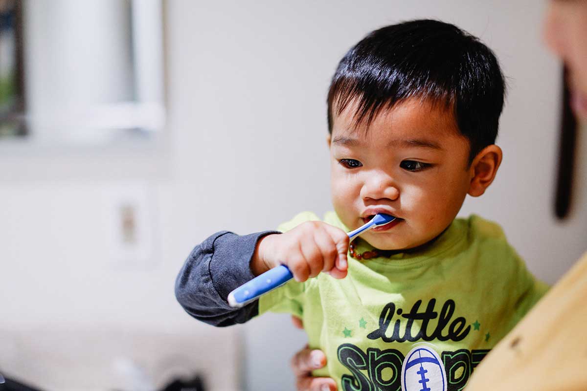 boy-learning-to-use-toothbrush