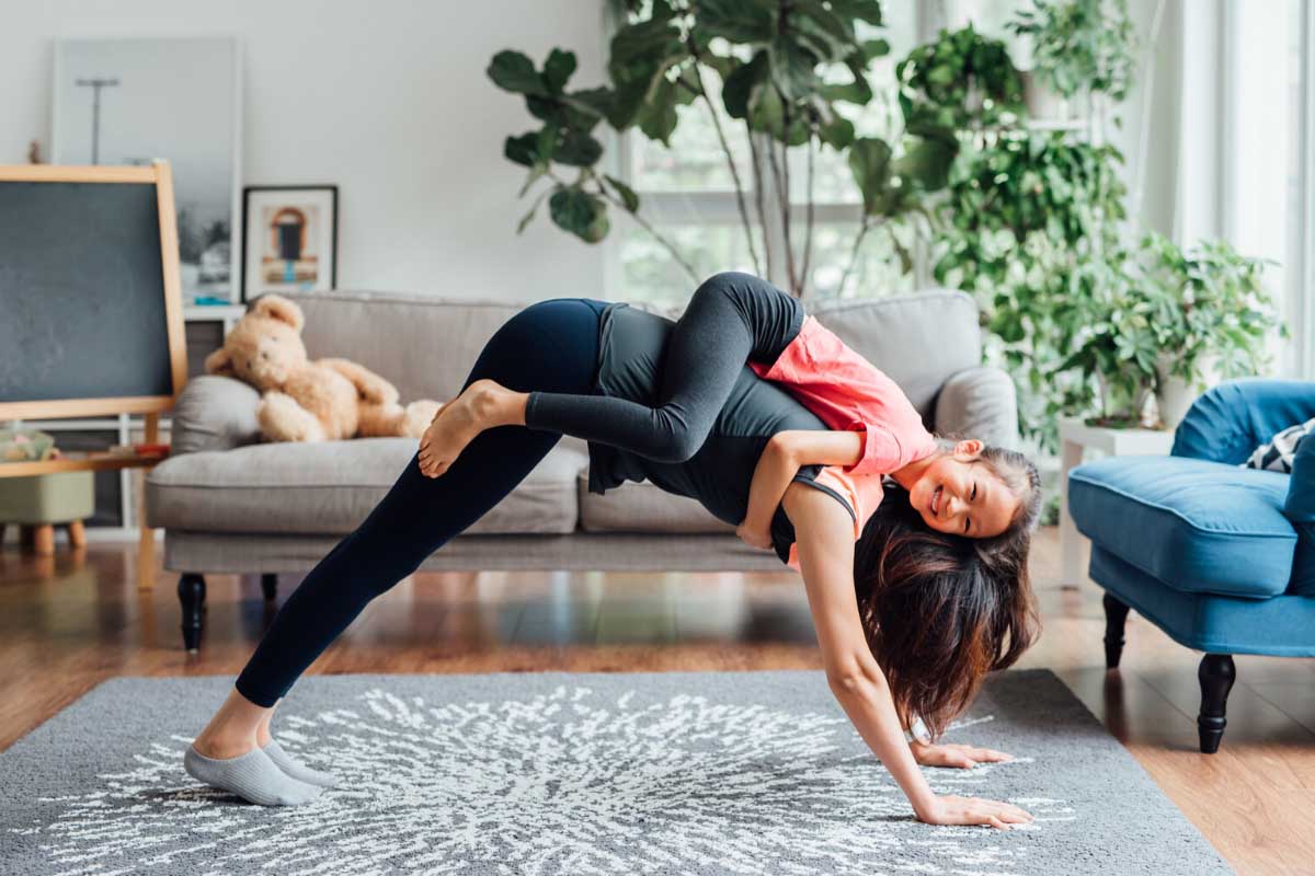 Woman with a young daughter exercising