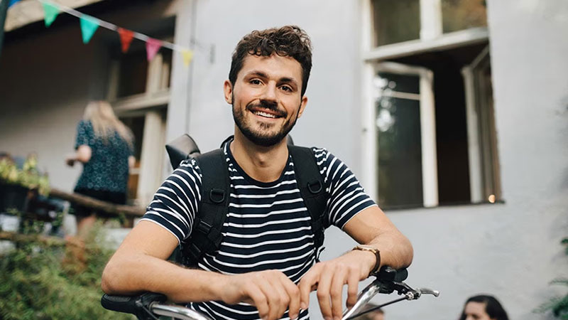Man smiling on bike