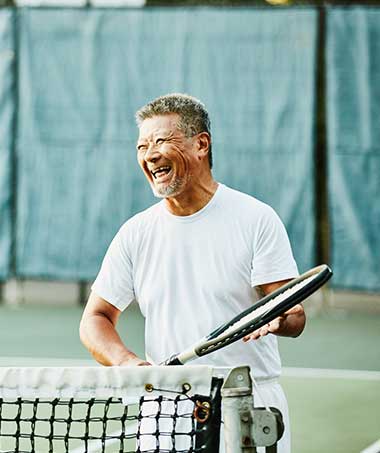 A man recovering from rotator cuff surgery who is playing tennis